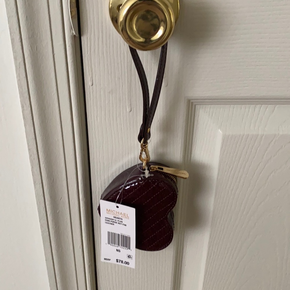 New with tags, heart shape, wine in color.